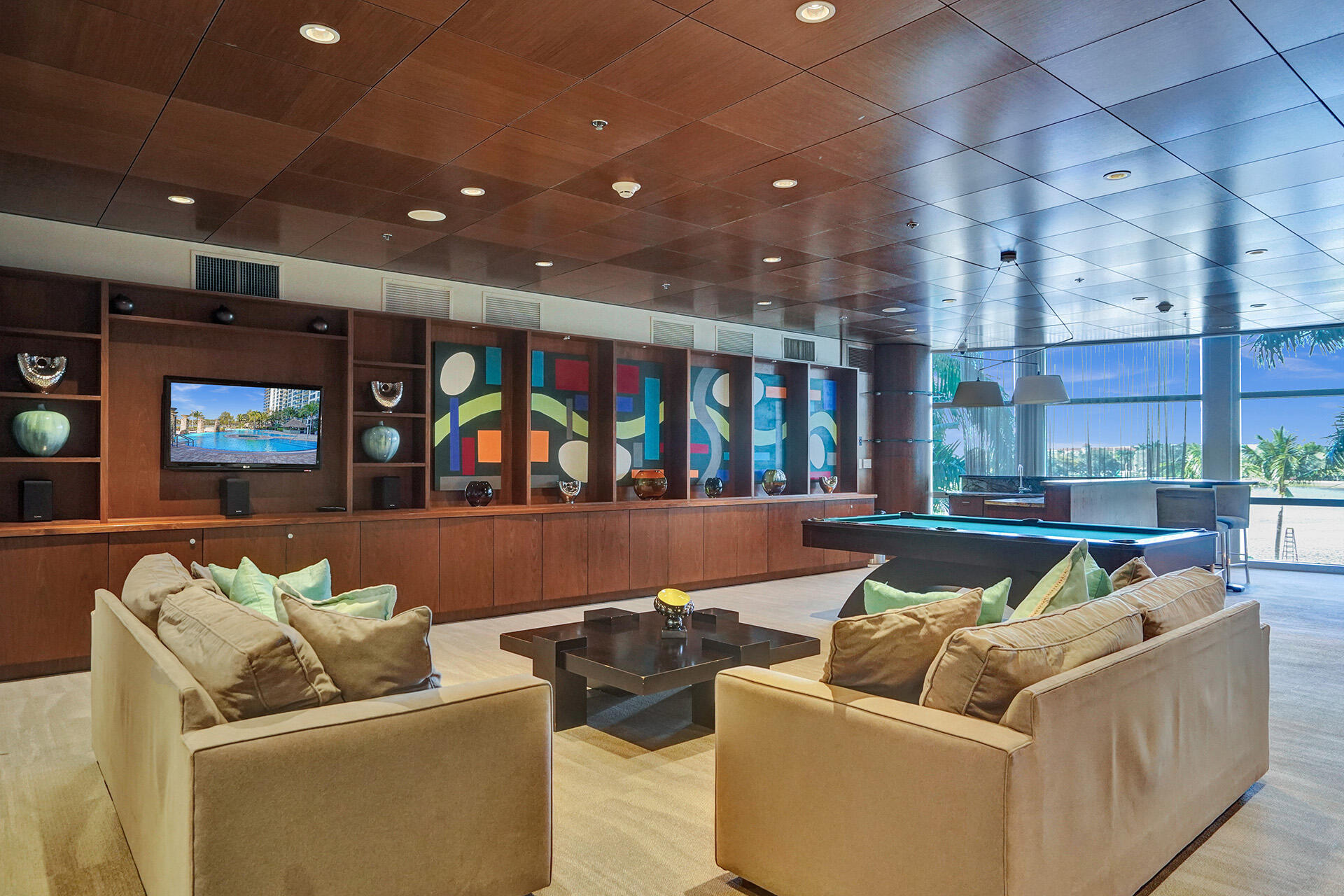 2641 North Flamingo Road, Unit 2105N Sunrise, FL 33323 - Photo 47 of 60 a living room with furniture and a flat screen tv