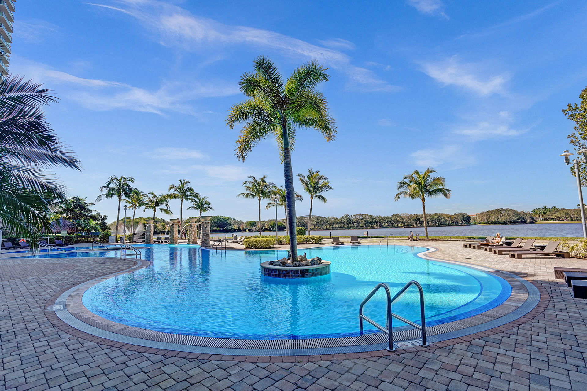 2641 North Flamingo Road, Unit 2105N Sunrise, FL 33323 - Photo 53 of 60 a view of a swimming pool with lounge chairs