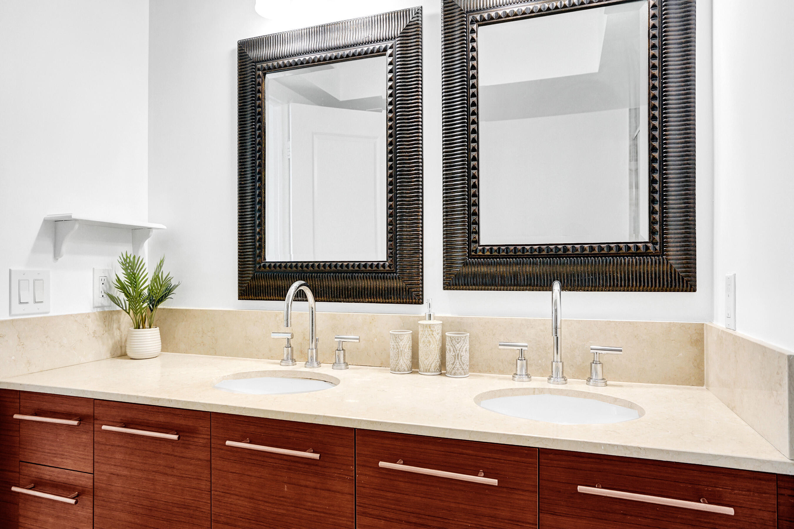 2641 North Flamingo Road, Unit 2105N Sunrise, FL 33323 - Photo 10 of 60 a bathroom with a double vanity sink and a mirror