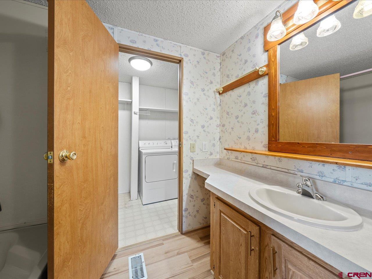 2602 1600th Road Delta, CO 81416 - Photo 15 of 42 a bathroom with a sink and a mirror