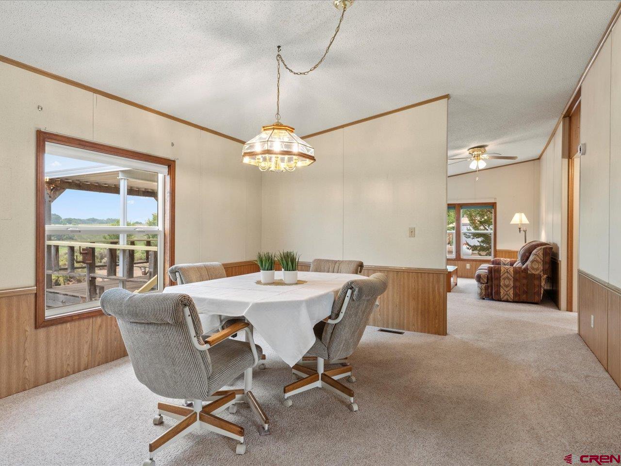 2602 1600th Road Delta, CO 81416 - Photo 18 of 42 a view of a dining room with furniture wooden floor and chandelier