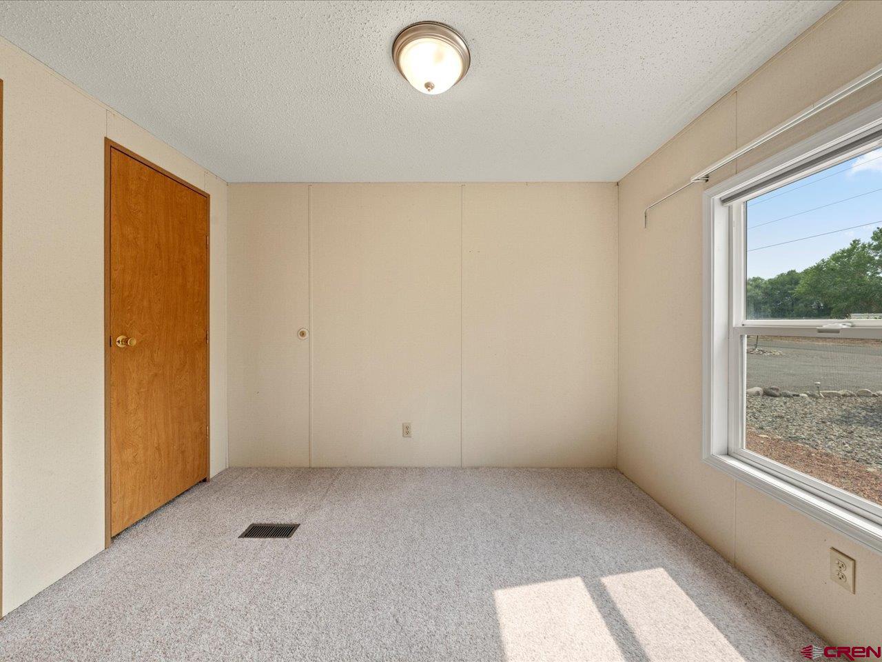2602 1600th Road Delta, CO 81416 - Photo 24 of 42 an empty room with windows