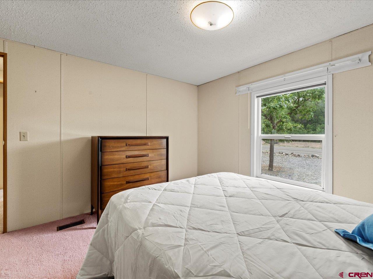 2602 1600th Road Delta, CO 81416 - Photo 28 of 42 a bedroom with a bed and a window