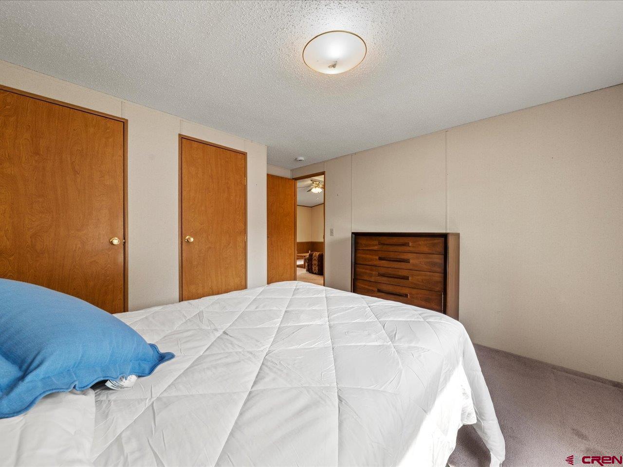 2602 1600th Road Delta, CO 81416 - Photo 29 of 42 a bedroom with a bed and a dresser