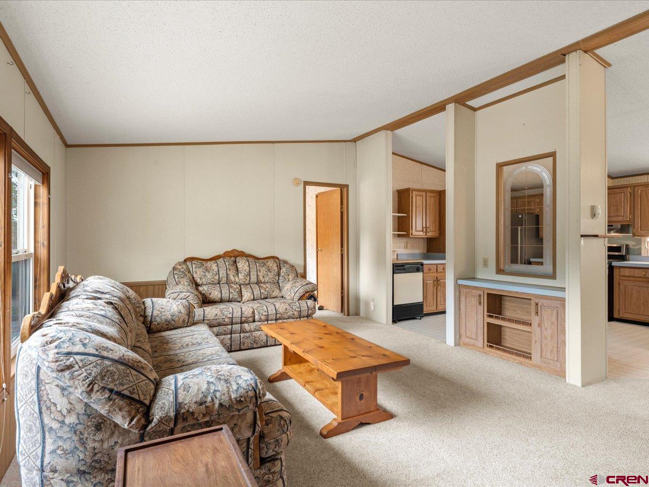2602 1600th Road Delta, CO 81416 - Photo 3 of 42 a living room with furniture and a fireplace