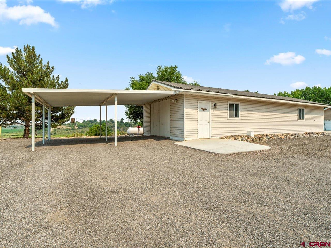 2602 1600th Road Delta, CO 81416 - Photo 33 of 42 a view of a house with backyard and a garden