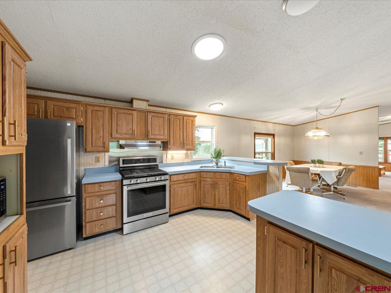2602 1600th Road Delta, CO 81416 - Photo 7 of 42 a kitchen with a sink stainless steel appliances and cabinets