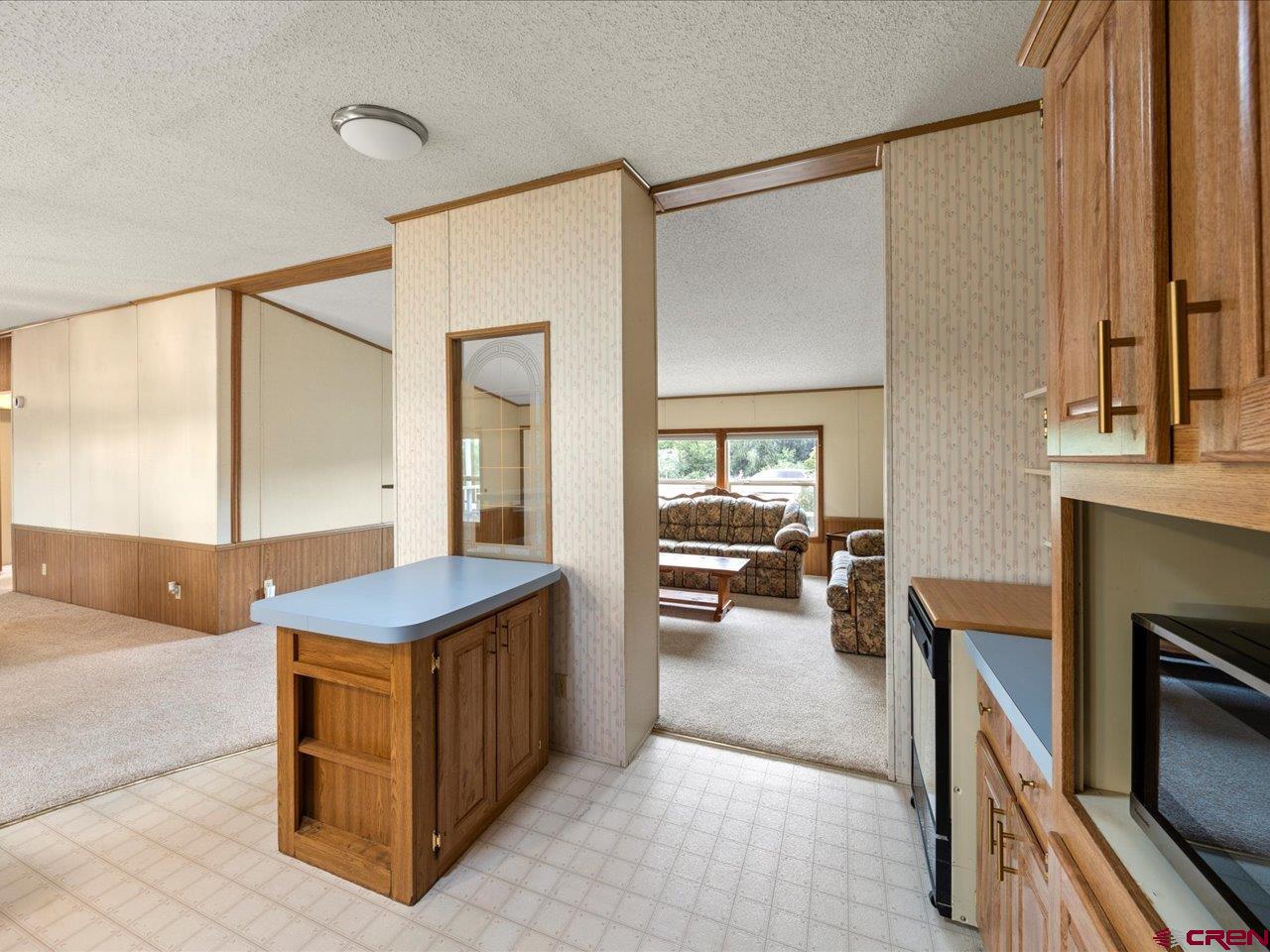 2602 1600th Road Delta, CO 81416 - Photo 8 of 42 a en suite bathroom with a sink a mirror and a bathtub