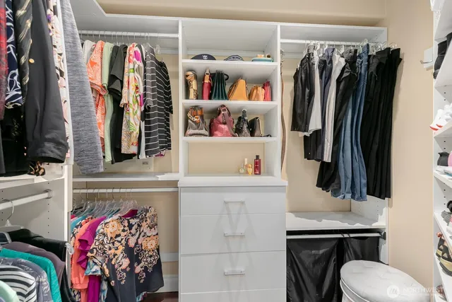 a livingroom with workspace couch and a window