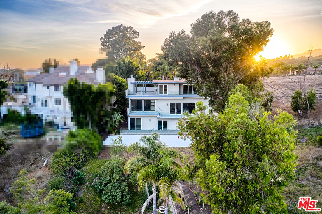 28907 Wight Road Malibu, CA 90265 - Photo 52 of 54 a house view with a garden space