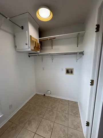 a view of a room with racks on the wall