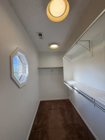 a view of a room with racks on the wall