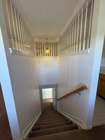 a room with furniture and wooden floor