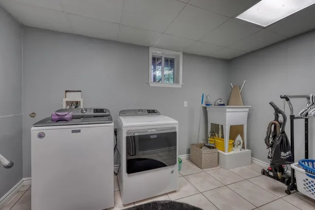 a view of storage and utility room with washer and dryer