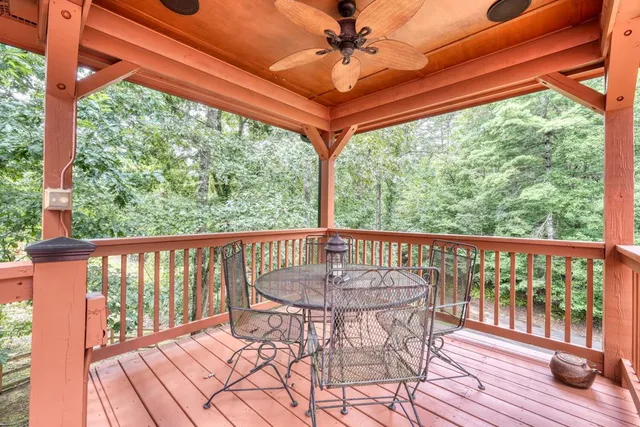 a view of a balcony with furniture