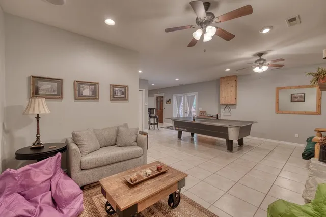 a living room with furniture and a table
