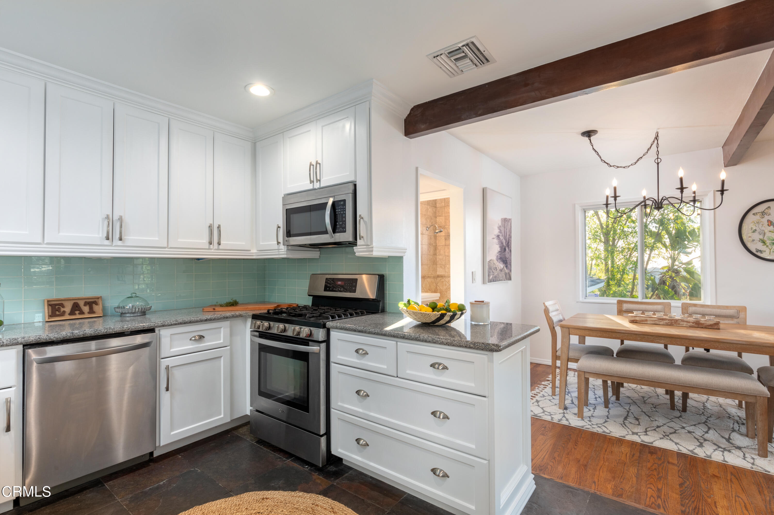 1850 Kaweah Drive Pasadena, CA 91105 - Photo 13 of 30 a kitchen with white cabinets and appliances