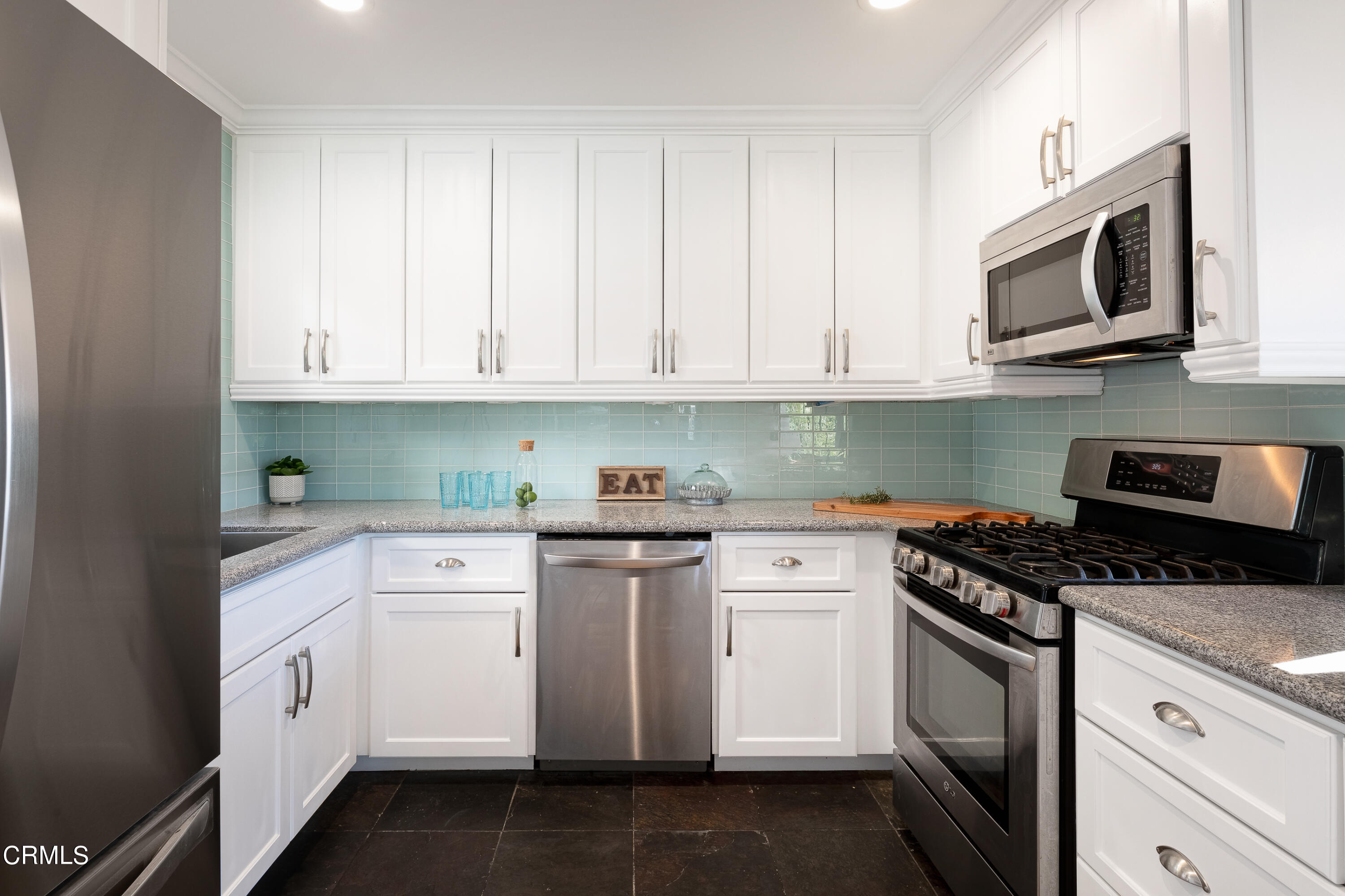 1850 Kaweah Drive Pasadena, CA 91105 - Photo 14 of 30 a kitchen with granite countertop white cabinets and stainless steel appliances