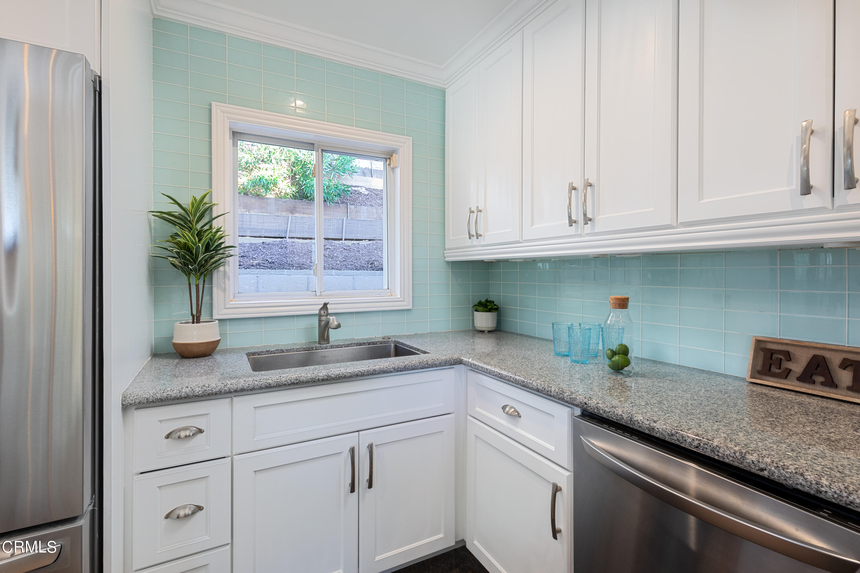 1850 Kaweah Drive Pasadena, CA 91105 - Photo 15 of 30 a kitchen with granite countertop a sink white cabinets and white stainless steel appliances