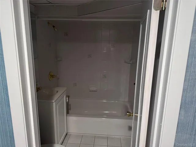 a view of a hallway with a room