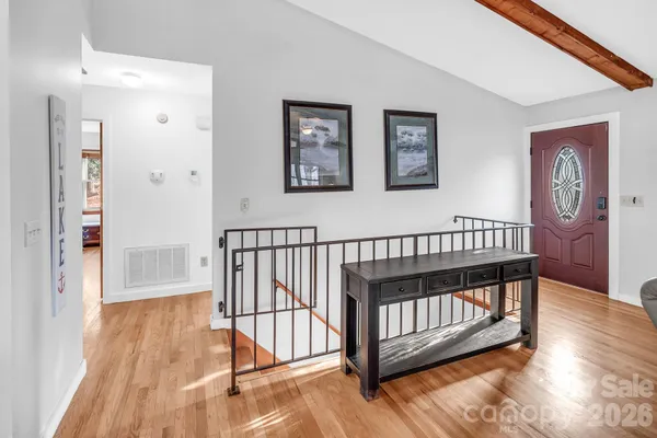 a view of entryway with wooden floor
