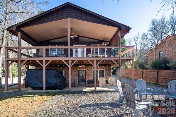 a view of a chairs and table in backyard