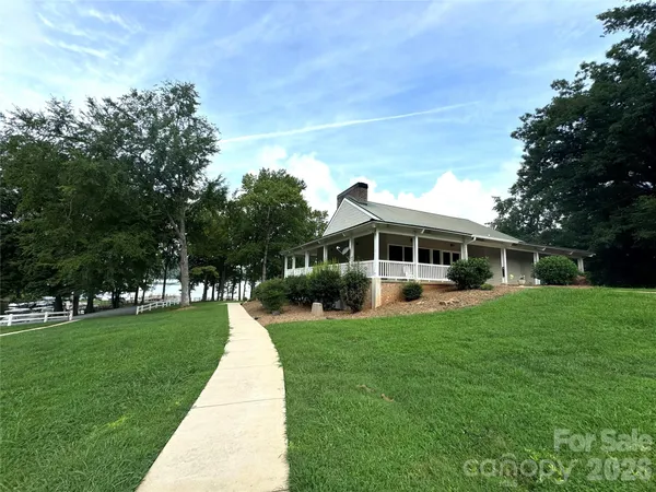 a view of outdoor space with deck and trees