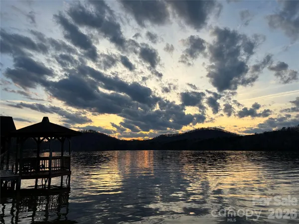 a view of ocean with sunset