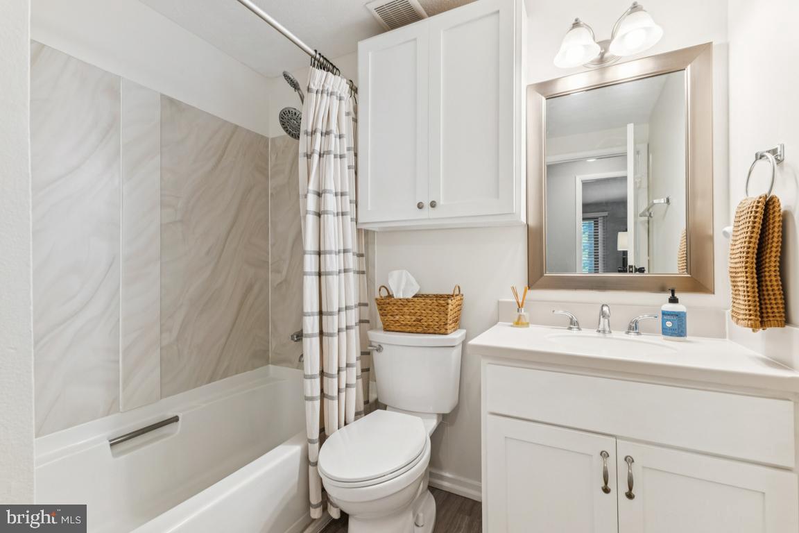 2269 Marginella Drive Reston, VA 20191 - Photo 14 of 29 a bathroom with a sink a toilet and shower