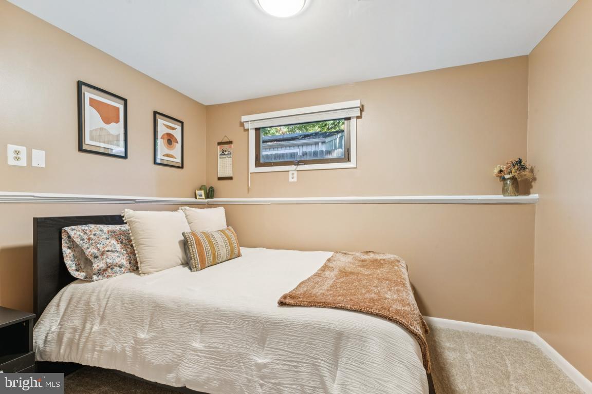 2269 Marginella Drive Reston, VA 20191 - Photo 22 of 29 a bedroom with a bed and a lamp on the dresser