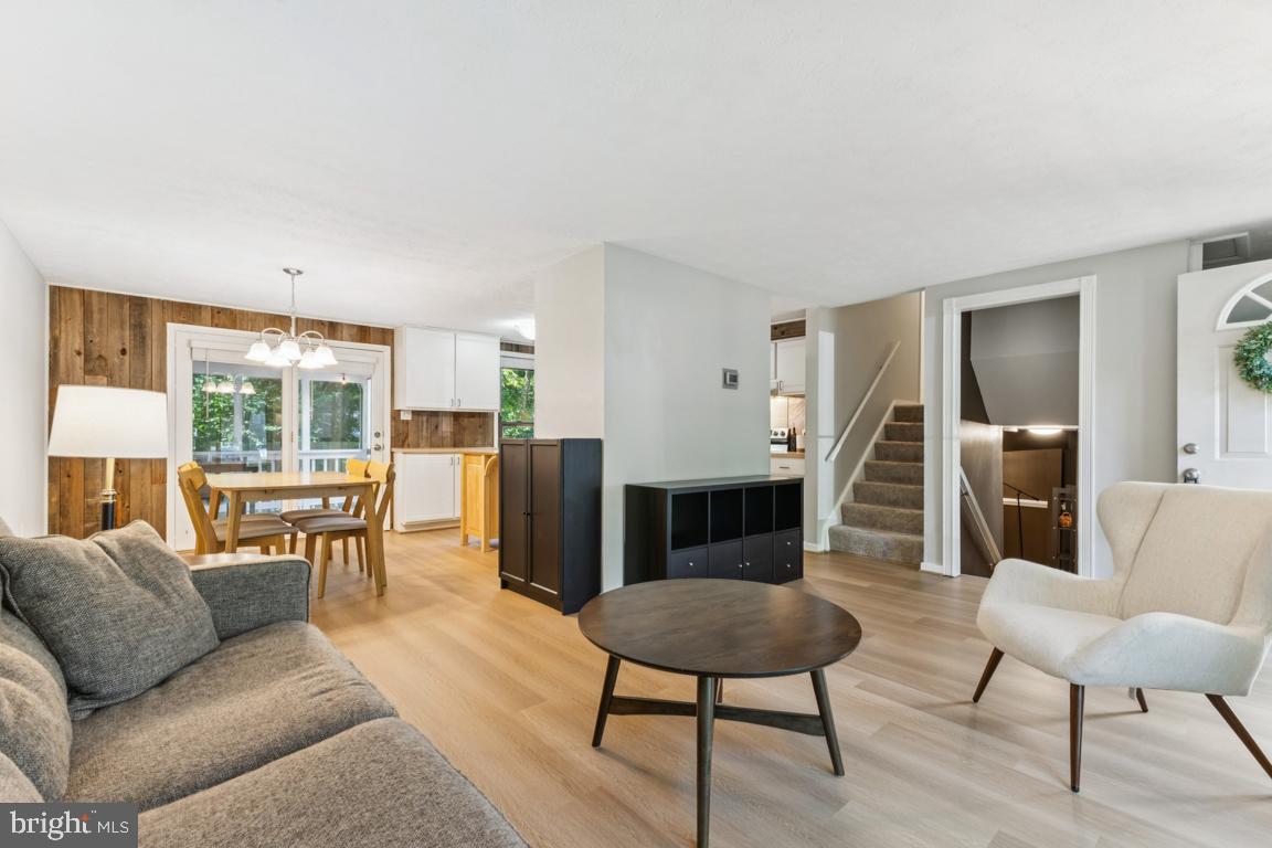 2269 Marginella Drive Reston, VA 20191 - Photo 4 of 29 a living room with furniture a large window and a table