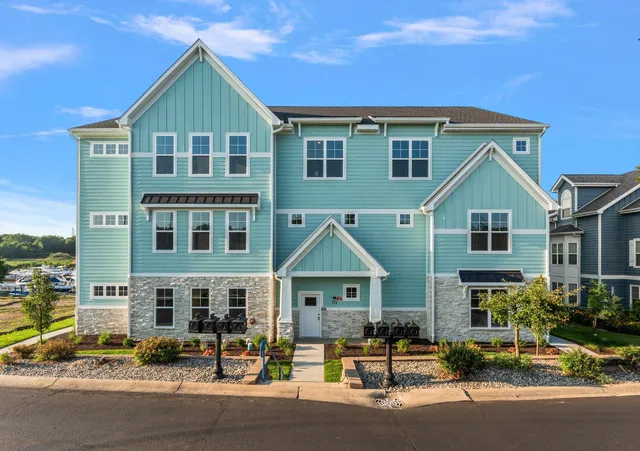 a view of multiple houses with a street