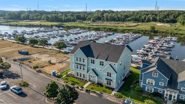 an aerial view of residential houses with outdoor space