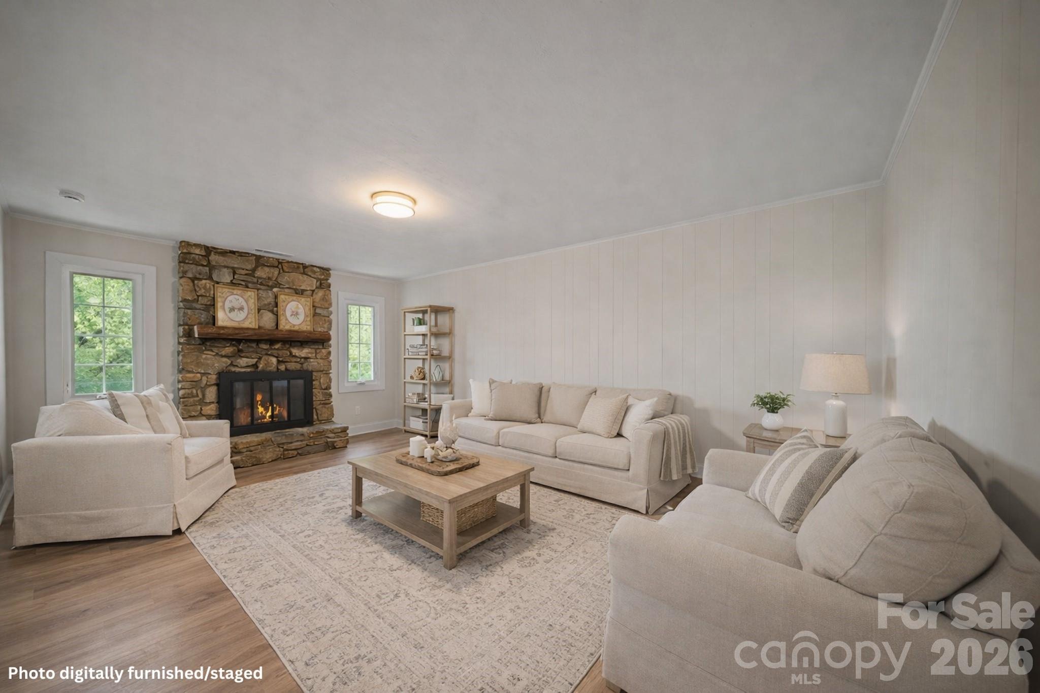 70 Melton Road Candler, NC 28715 - Photo 11 of 35 a living room with furniture and a flat screen tv