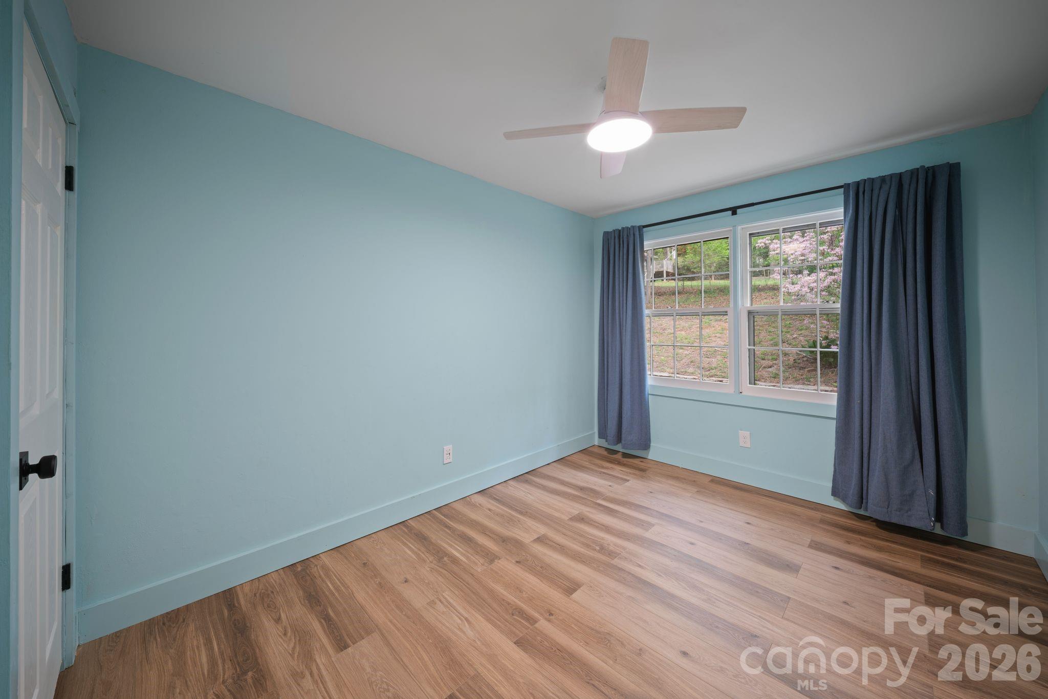 70 Melton Road Candler, NC 28715 - Photo 28 of 35 a view of an empty room with a window
