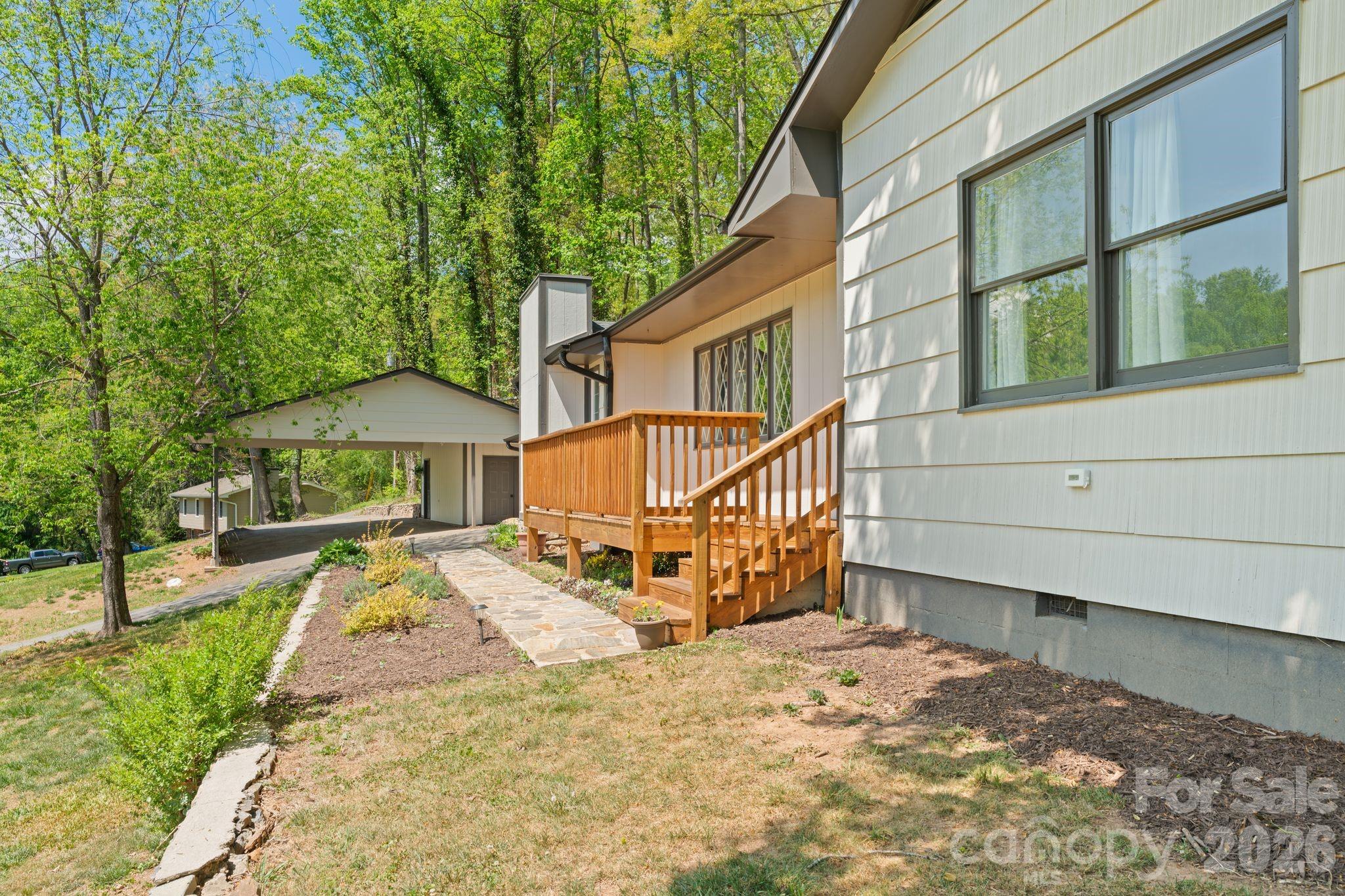 70 Melton Road Candler, NC 28715 - Photo 4 of 35 a view of a house with a yard