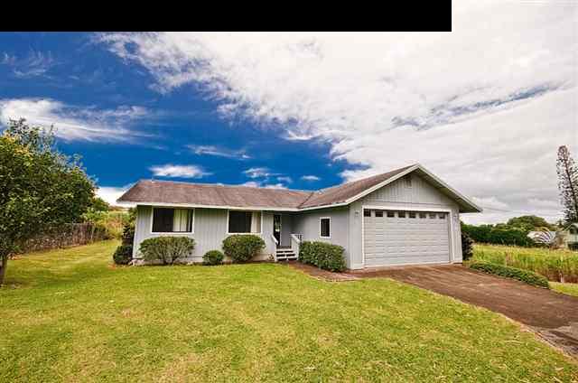 950 Akoa Place Haiku, HI 96708 - Photo 1 of 25 a front view of a house with a garden