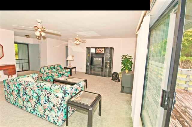 950 Akoa Place Haiku, HI 96708 - Photo 17 of 25 a living room with furniture and a large window