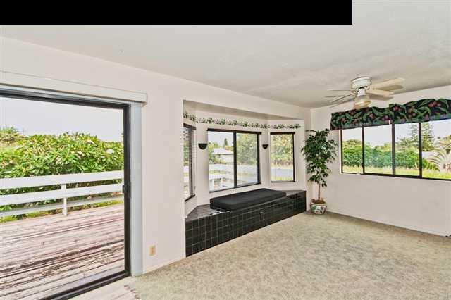 950 Akoa Place Haiku, HI 96708 - Photo 20 of 25 a living room with a large window