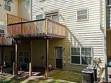 a view of a livingroom with a fireplace and wooden floor