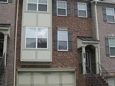 a kitchen with stainless steel appliances granite countertop a refrigerator stove and sink