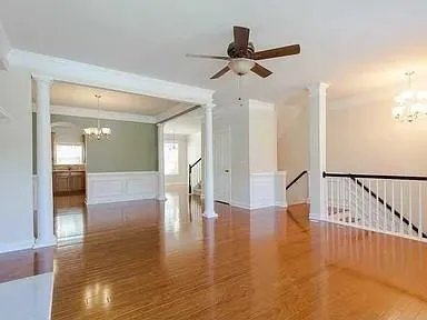 a view of an entryway with wooden floor