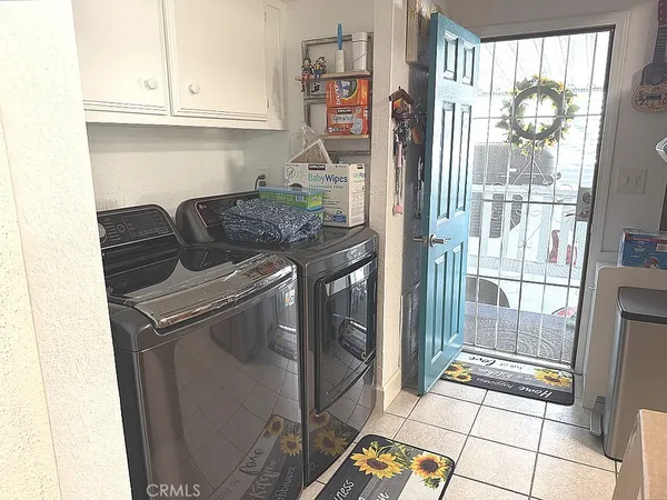 a kitchen with granite countertop a refrigerator and a stove