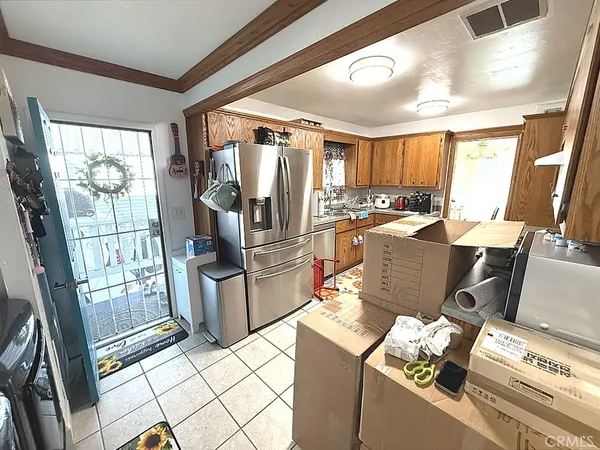 a view of a open kitchen with a stove