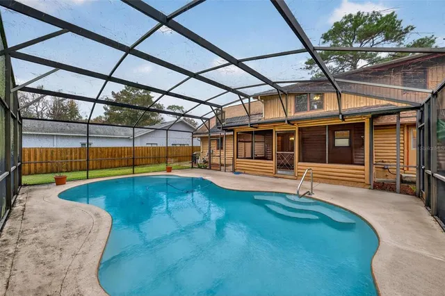 a view of room with large windows