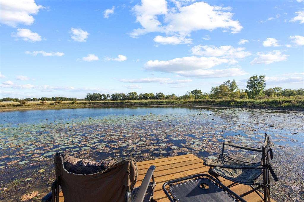 300 County Road Roxton, TX 75477 - Photo 17 of 37 a view of a lake with outdoor seating