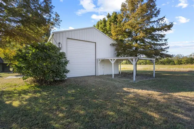 a view of a yard with a tree