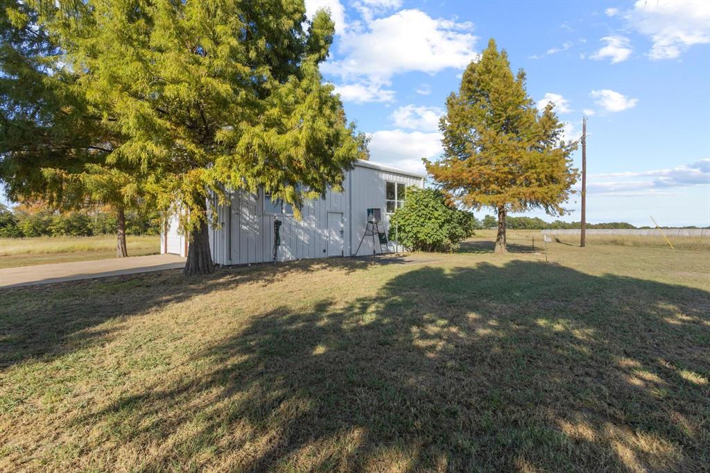300 County Road Roxton, TX 75477 - Photo 20 of 37 a view of a yard with plants and trees