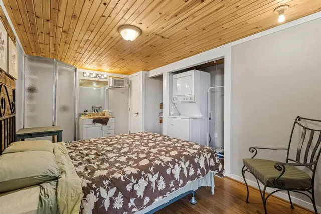 a kitchen with a refrigerator a stove top oven a sink and dishwasher