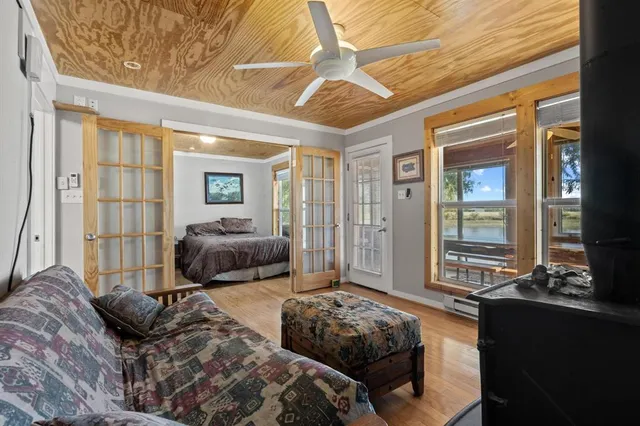 a bedroom with furniture and windows